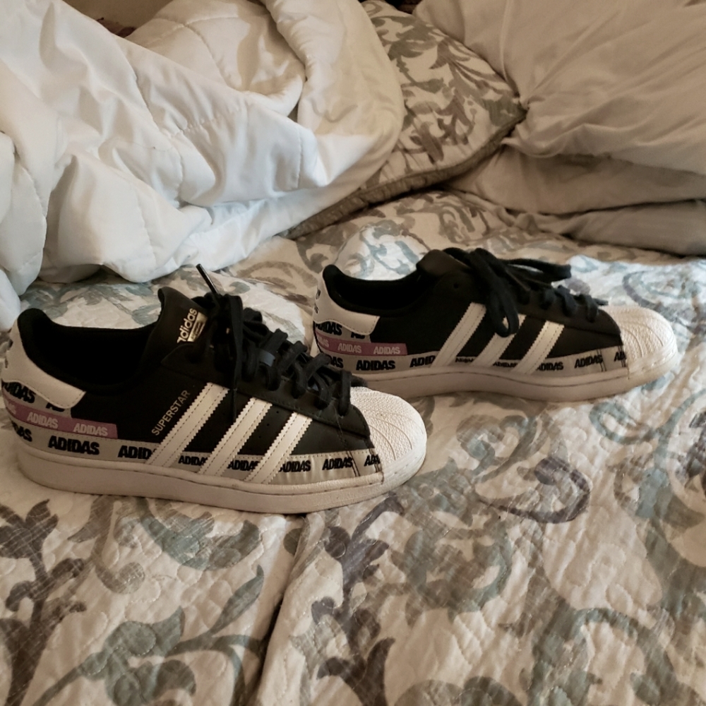 Adidas. Shell toes. There are black white and red. Size 8 men's.